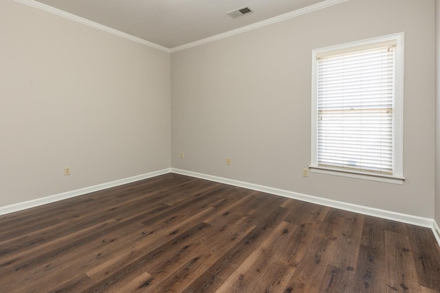 empty room with dark hardwood / wood-style flooring and crown molding