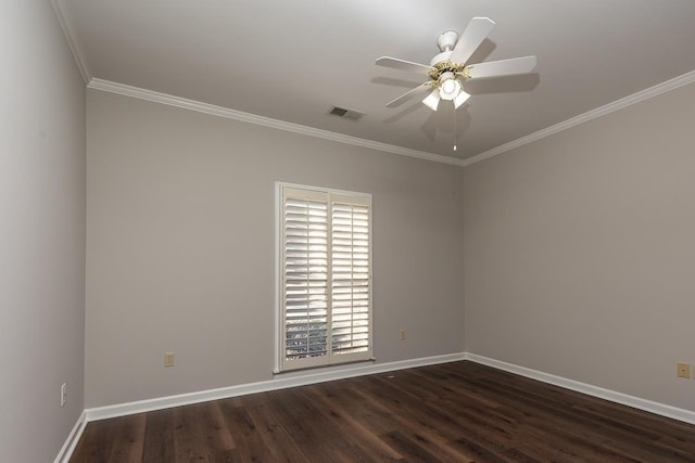 empty room featuring ceiling fan, ornamental molding, and dark hardwood / wood-style flooring