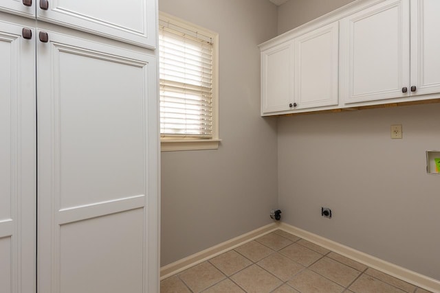 laundry room with cabinets, washer hookup, hookup for an electric dryer, and light tile patterned floors