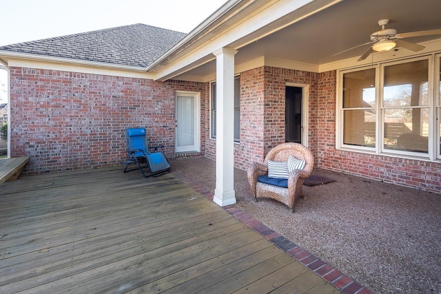 wooden deck featuring ceiling fan