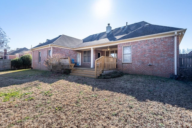 rear view of house with a yard