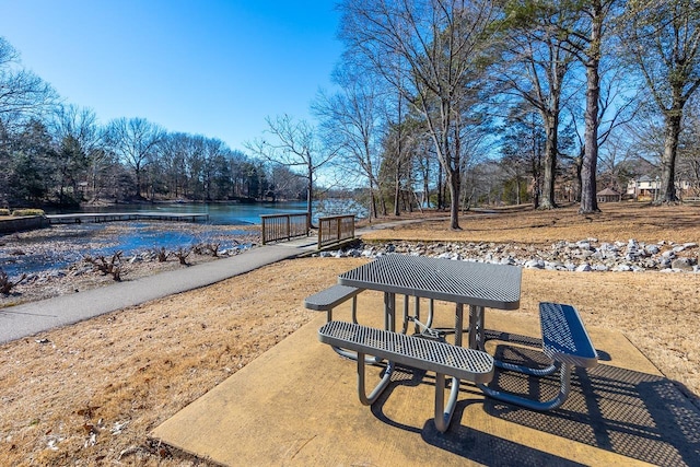 view of community with a water view