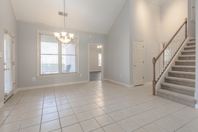 unfurnished room with crown molding, a chandelier, high vaulted ceiling, and light tile patterned floors