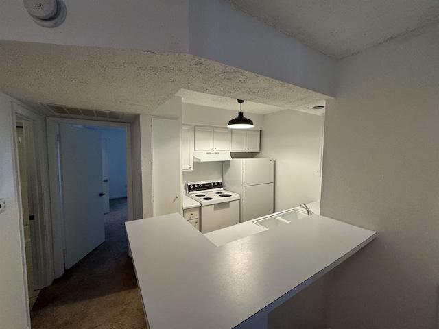 kitchen featuring sink, white cabinetry, kitchen peninsula, pendant lighting, and white appliances