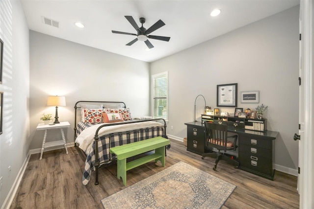 bedroom featuring dark hardwood / wood-style flooring and ceiling fan