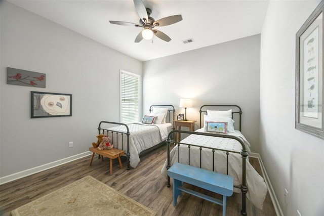 bedroom featuring dark hardwood / wood-style floors and ceiling fan