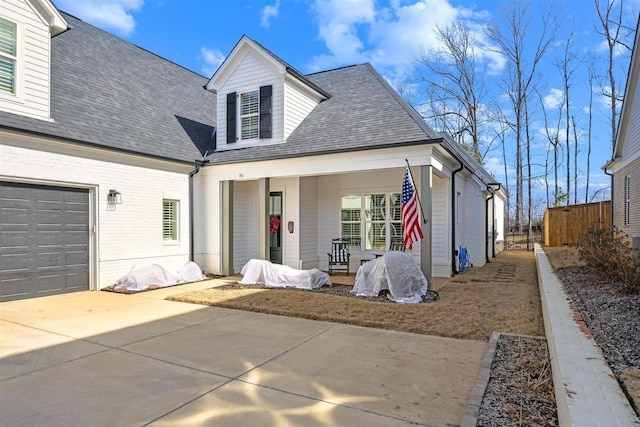 view of front of home with a garage and covered porch