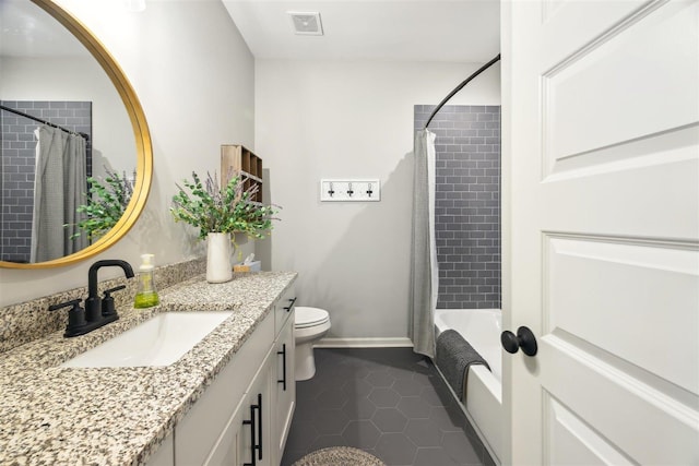 full bathroom with shower / tub combo with curtain, vanity, toilet, and tile patterned flooring