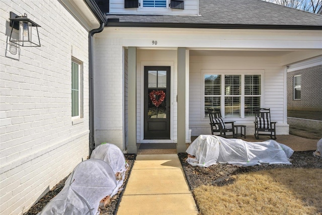 entrance to property featuring a porch