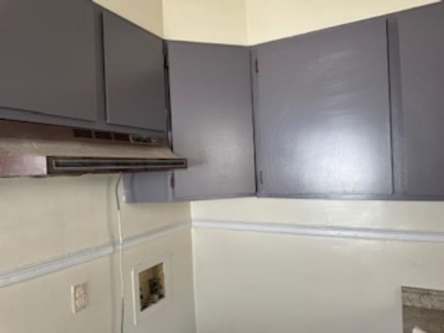 laundry room featuring hookup for a washing machine and cabinets