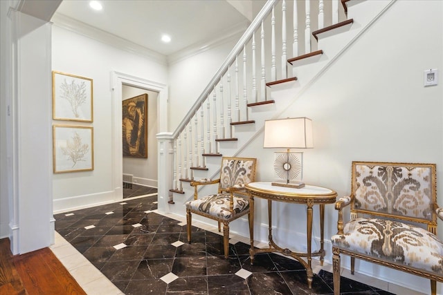 foyer featuring crown molding