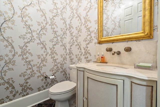 bathroom with vanity and toilet