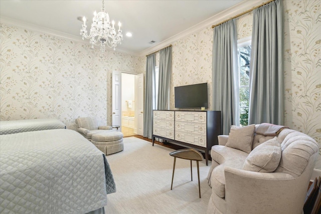 bedroom with an inviting chandelier, crown molding, and ensuite bath