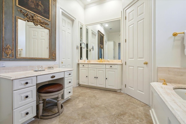 bathroom featuring vanity and crown molding