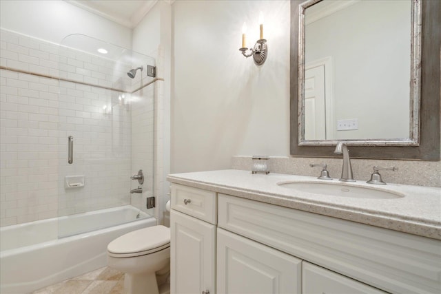 full bathroom with crown molding, tile patterned flooring, tiled shower / bath combo, vanity, and toilet