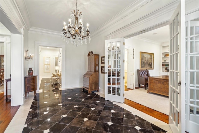 interior space with french doors, wood-type flooring, crown molding, and a notable chandelier