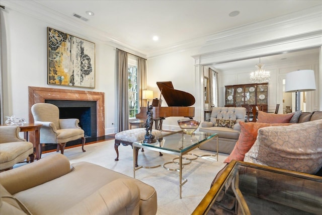 living room featuring an inviting chandelier and ornamental molding