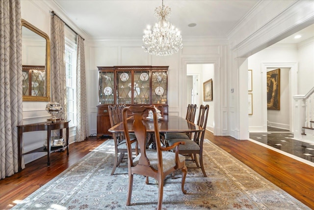 dining room with crown molding and dark hardwood / wood-style floors