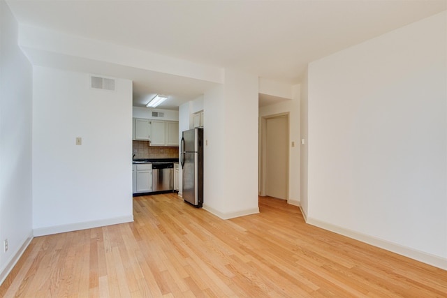 unfurnished living room featuring light hardwood / wood-style flooring