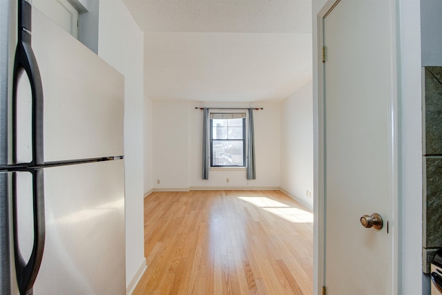 unfurnished room featuring light hardwood / wood-style flooring