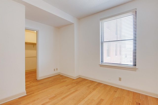 empty room featuring wood-type flooring