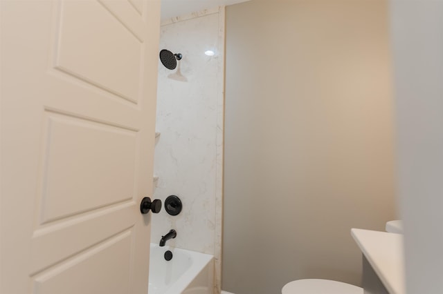 bathroom featuring shower / washtub combination and toilet