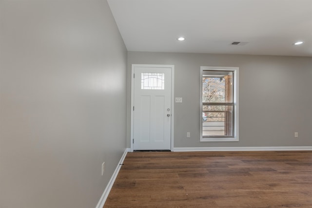 foyer entrance with dark wood-type flooring