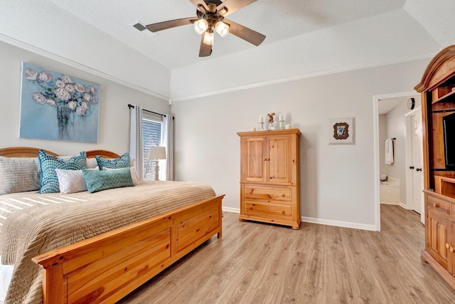 bedroom with lofted ceiling, ensuite bathroom, ceiling fan, and light wood-type flooring