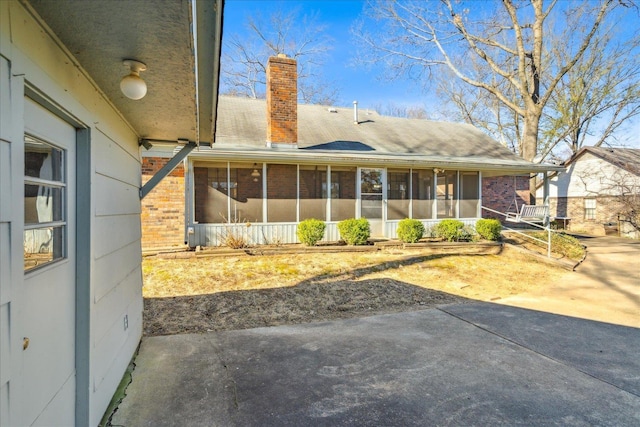 rear view of house with a sunroom