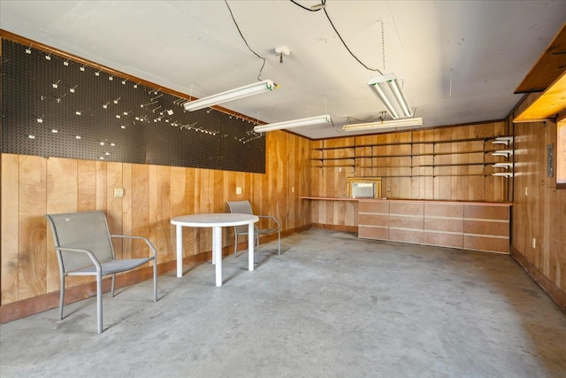 garage featuring wood walls