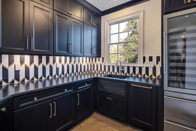 kitchen featuring wine cooler, light hardwood / wood-style floors, and sink