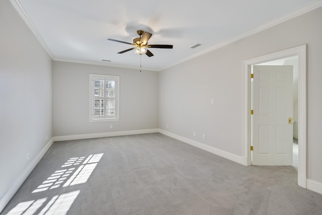 carpeted empty room with ceiling fan and ornamental molding