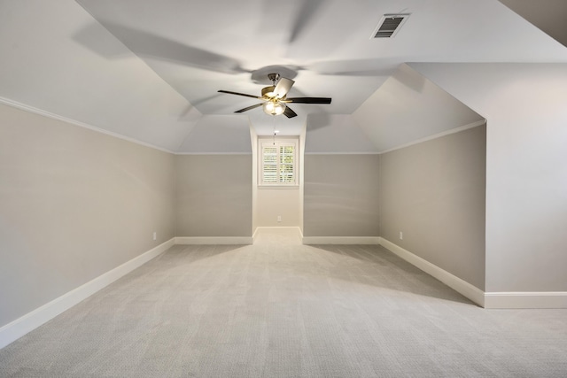 bonus room featuring lofted ceiling, light colored carpet, and ceiling fan