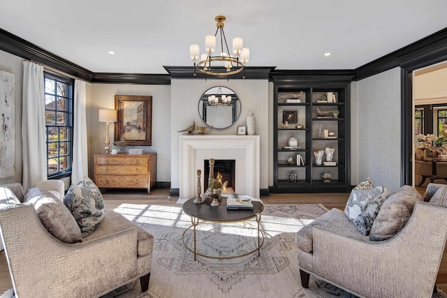 living room with crown molding, wood-type flooring, and a chandelier