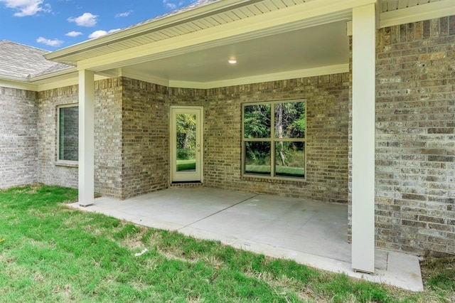 entrance to property featuring a patio area