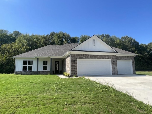 ranch-style house with a garage and a front lawn