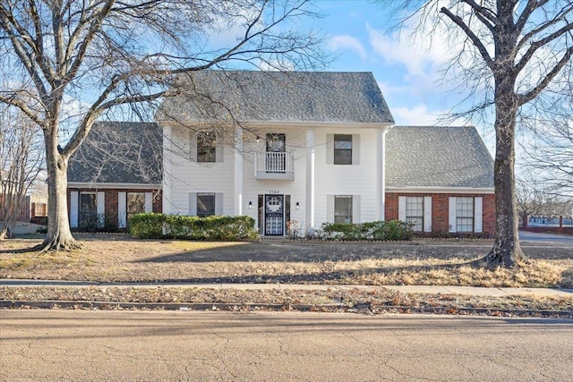 view of front of home with a balcony