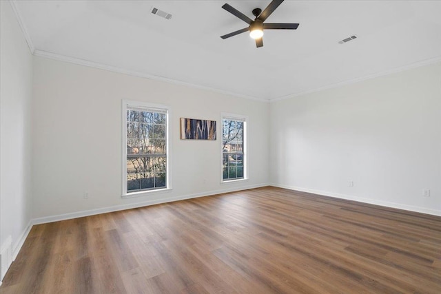 empty room featuring crown molding, ceiling fan, and hardwood / wood-style floors