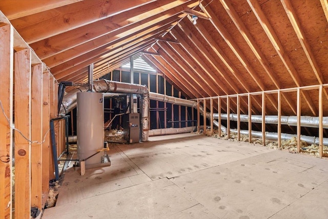 unfinished attic featuring water heater