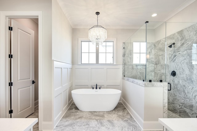 full bathroom with a wainscoted wall, marble finish floor, a decorative wall, and a stall shower