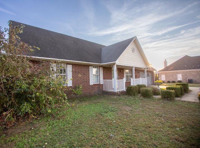 exterior space featuring a yard and covered porch