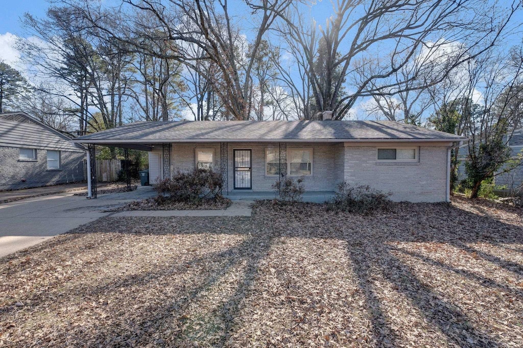 ranch-style home with a carport