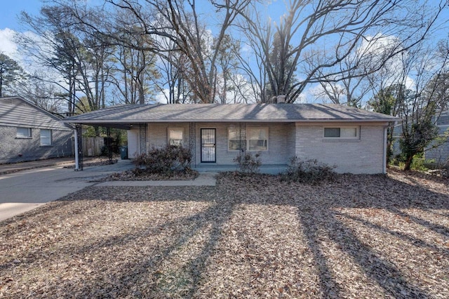 ranch-style home with a carport