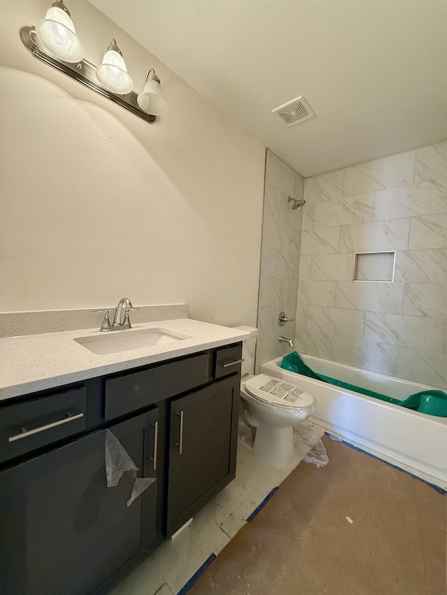 full bath featuring shower / washtub combination, marble finish floor, visible vents, toilet, and vanity