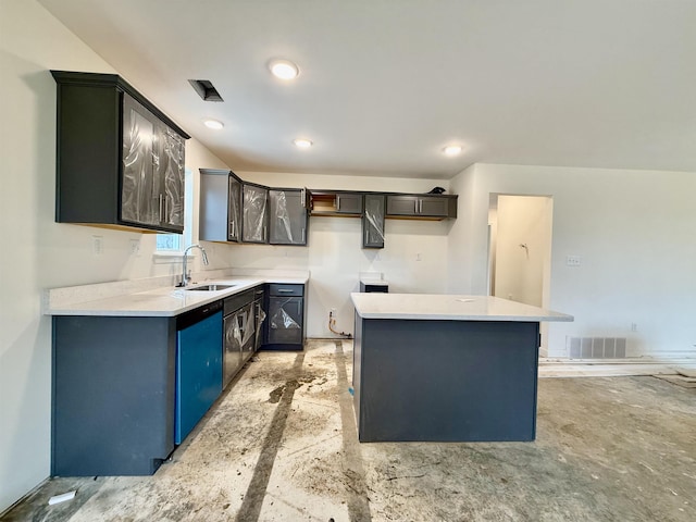 kitchen with a center island, recessed lighting, light countertops, visible vents, and a sink