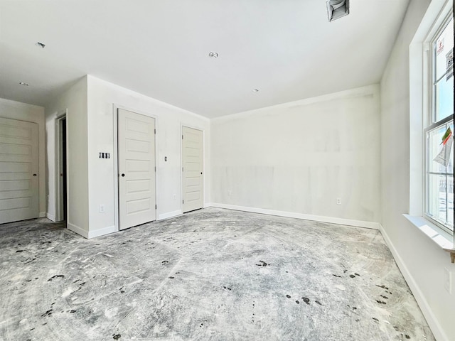 empty room with baseboards