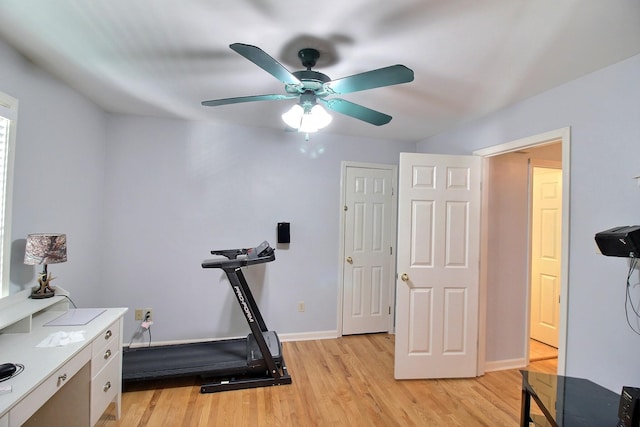 workout area with ceiling fan and light hardwood / wood-style flooring