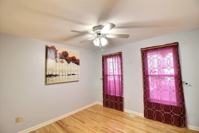 entrance foyer featuring ceiling fan and wood-type flooring