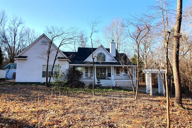 view of front facade with covered porch and a pergola