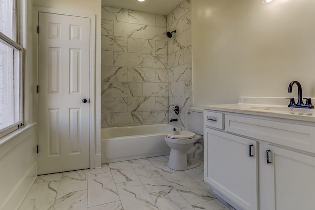 full bathroom with tiled shower / bath, vanity, and toilet